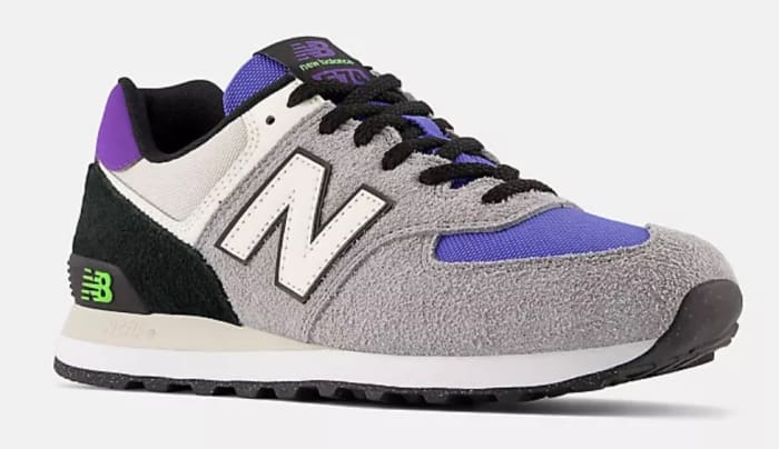 View of grey and purple New Balance shoes.